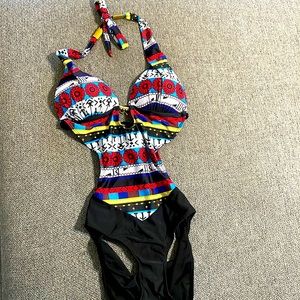 NWOT Multicolored Woman’s XL one piece bathing suit.